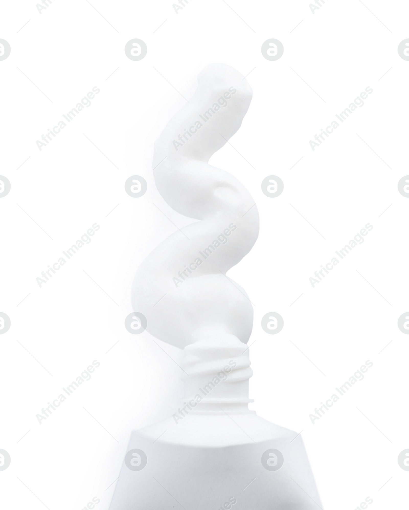 Photo of Tube with squeezed out toothpaste on white background, top view