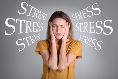 Stressed young woman and text on grey background