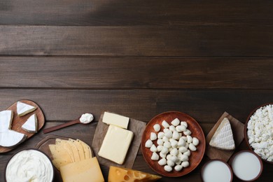 Photo of Flat lay composition with dairy products on wooden table. Space for text