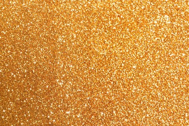 Image of Beautiful shiny golden glitter as background, closeup