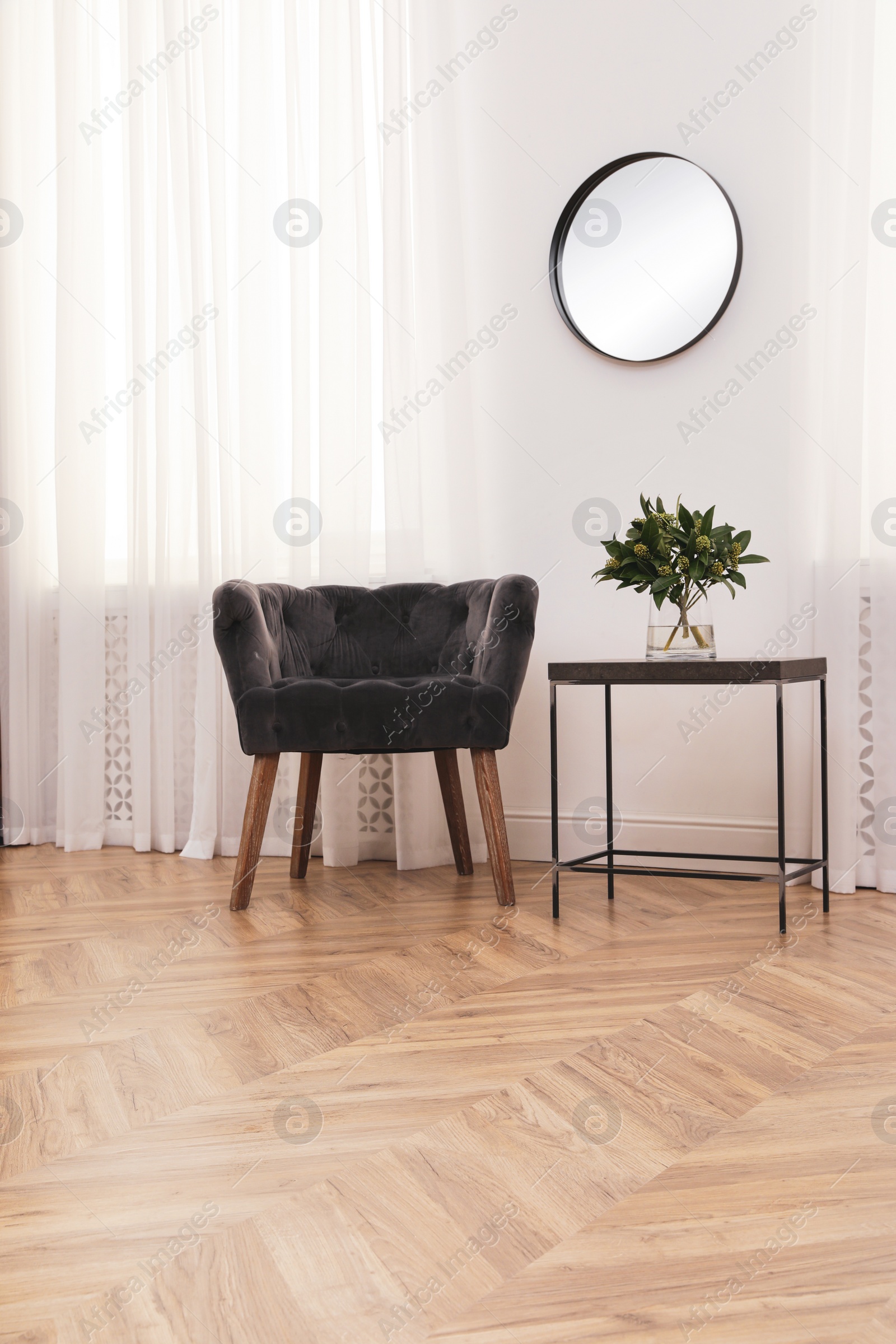 Photo of Modern living room with parquet flooring and stylish furniture