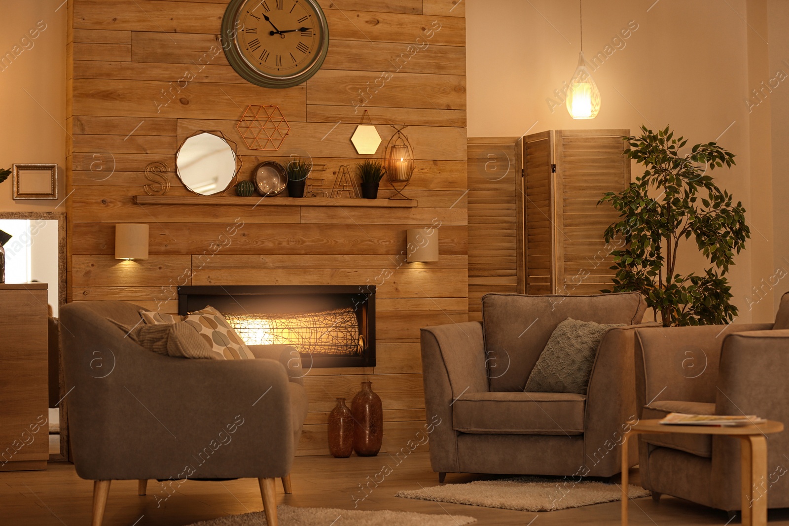 Photo of Cozy living room interior with comfortable furniture and decorative fireplace