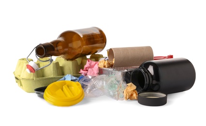 Photo of Pile of different garbage on white background. Trash recycling