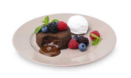Photo of Delicious chocolate fondant served with fresh berries and ice cream isolated on white