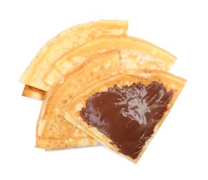 Tasty crepes with chocolate paste isolated on white, top view