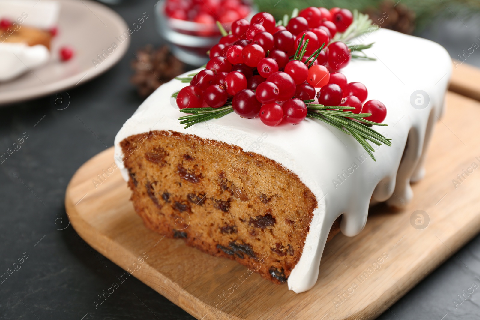 Photo of Traditional Christmas cake on black table, closeup. Classic recipe