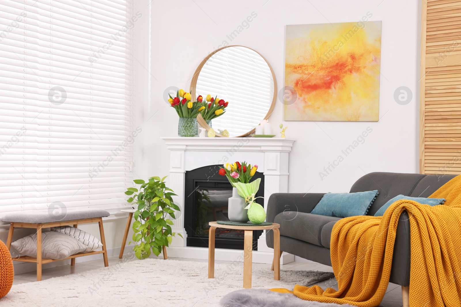 Photo of Beautiful Easter decorations and furniture in stylish room