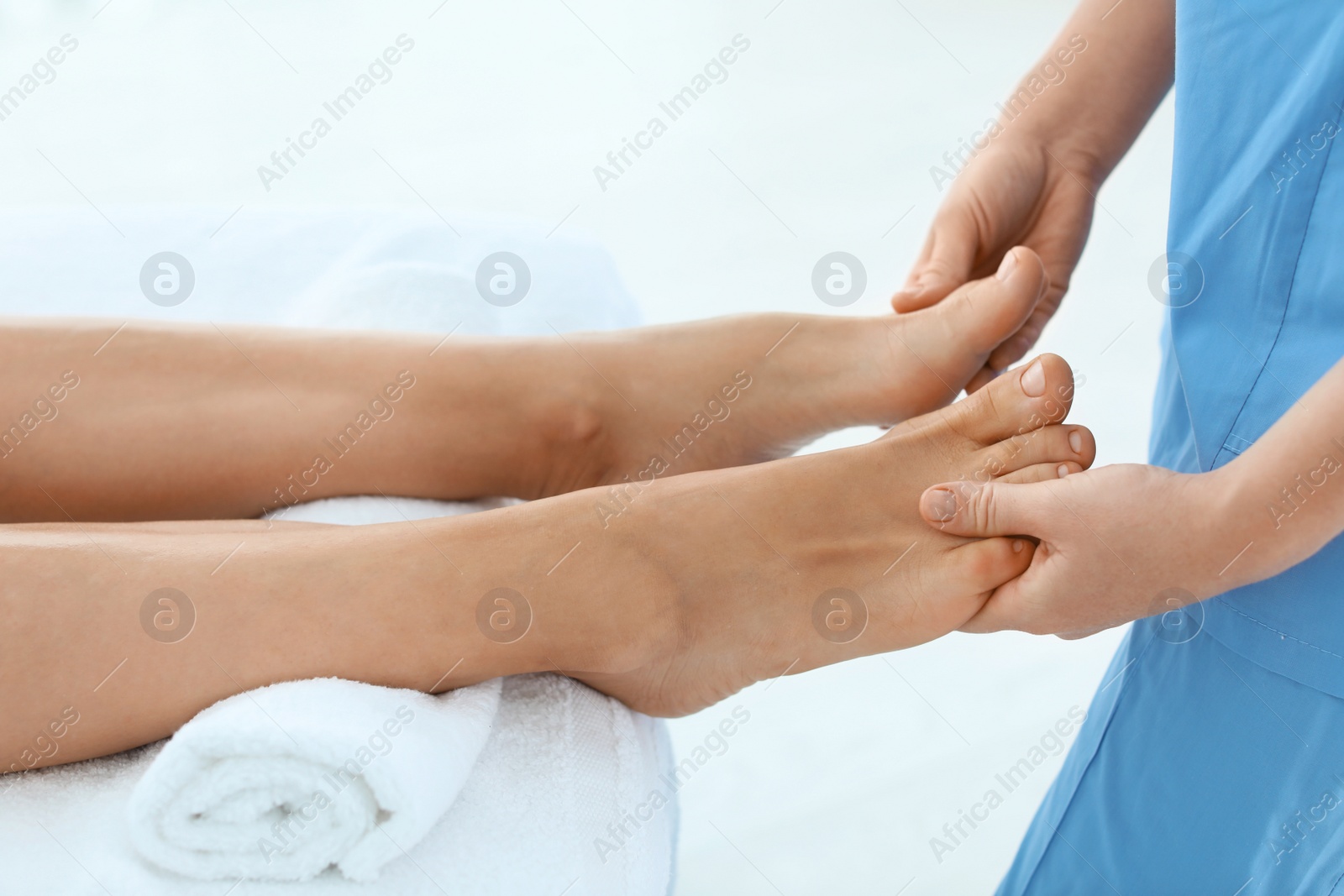 Photo of Woman receiving leg massage in wellness center, closeup