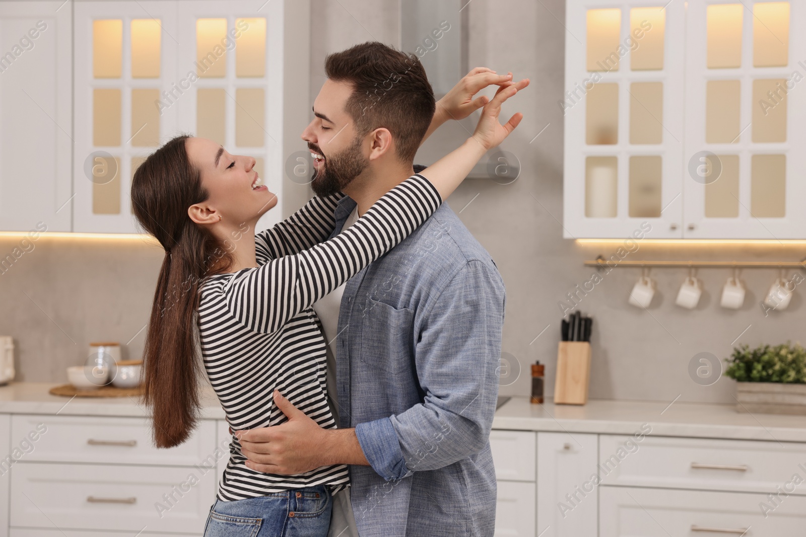 Photo of Lovely couple enjoying time together in kitchen