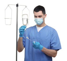 Photo of Nurse setting up IV drip on white background