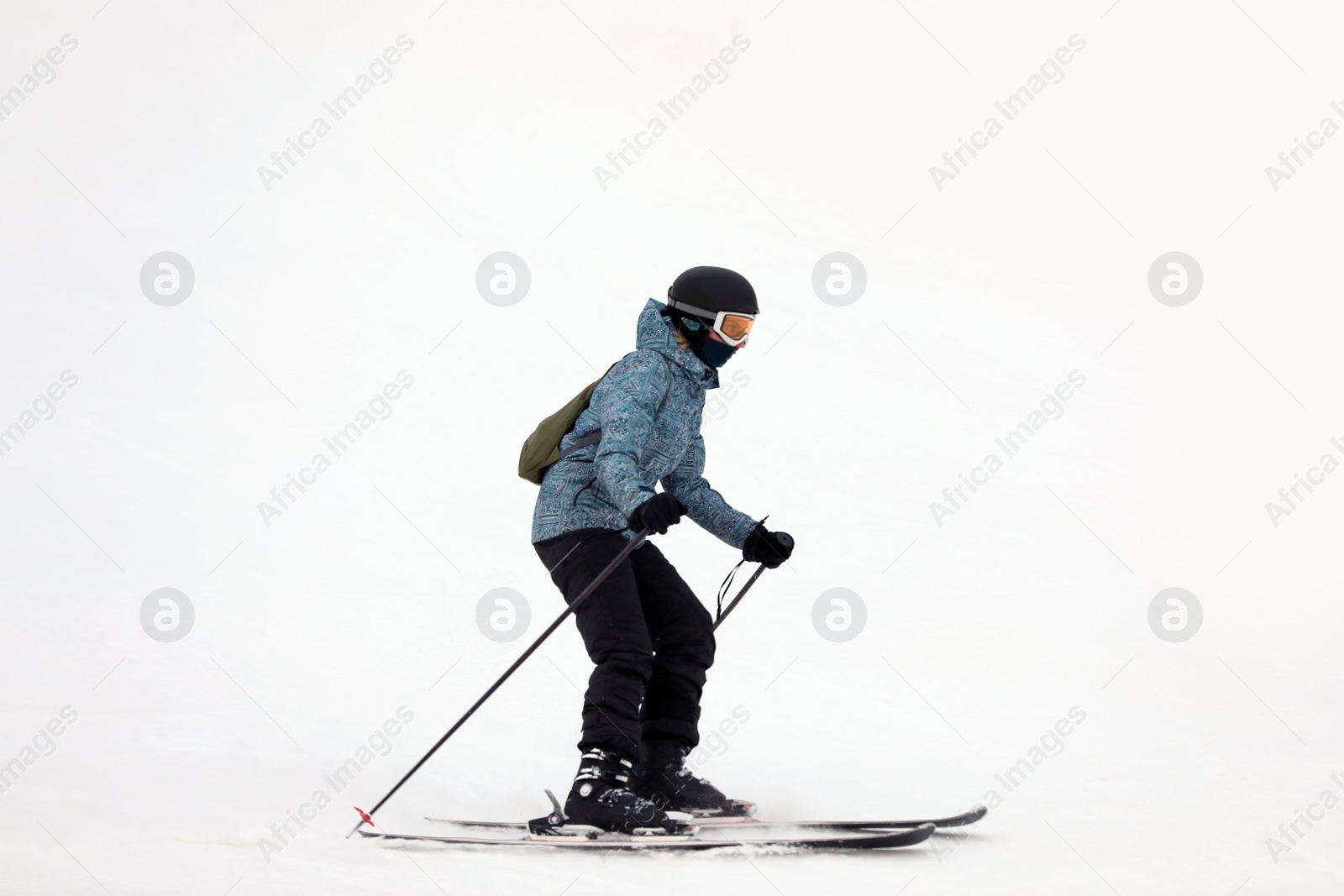 Photo of Skier on slope at resort. Winter vacation