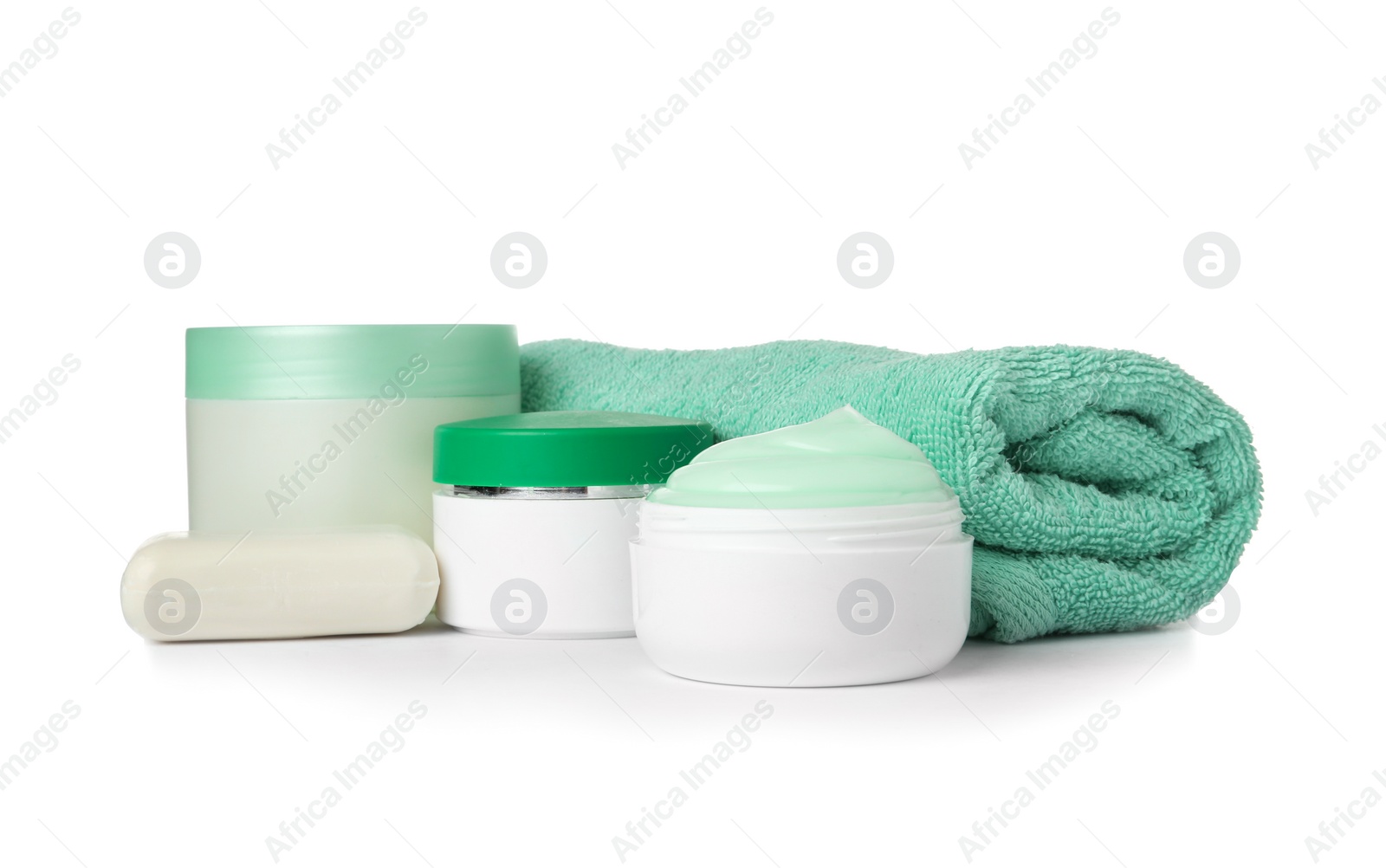 Photo of Different body care products and towel on white background