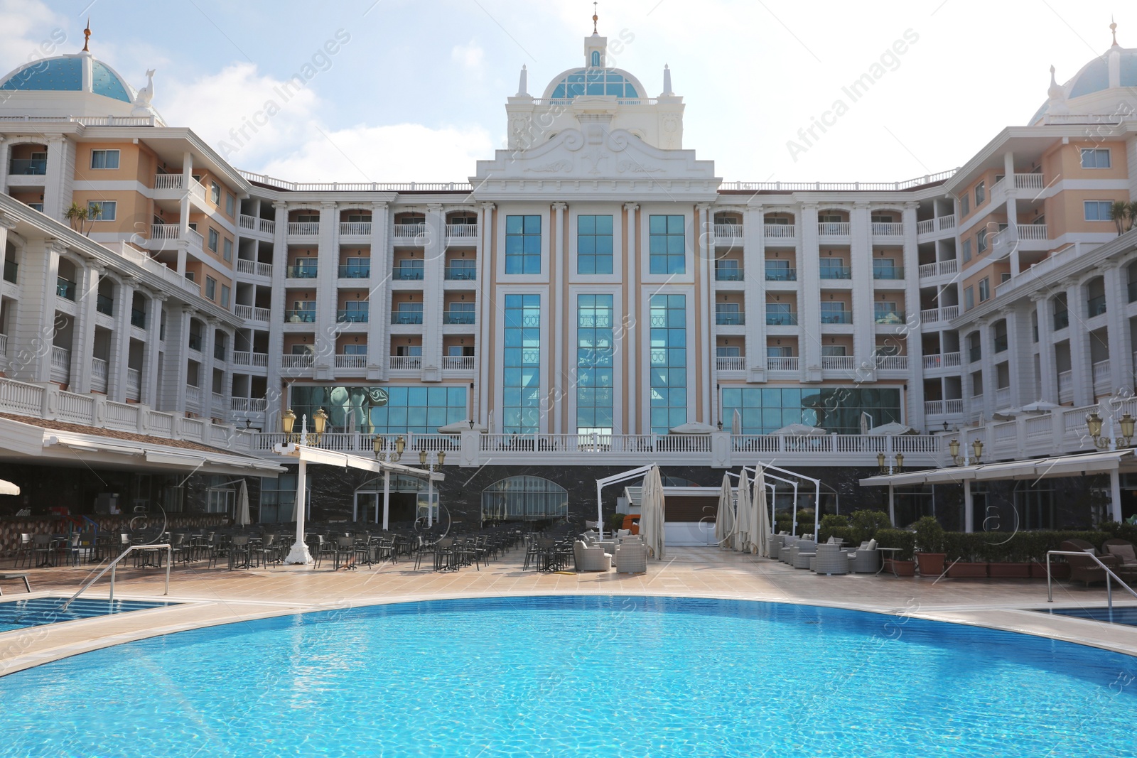 Photo of Beautiful view of hotel with swimming pool at resort