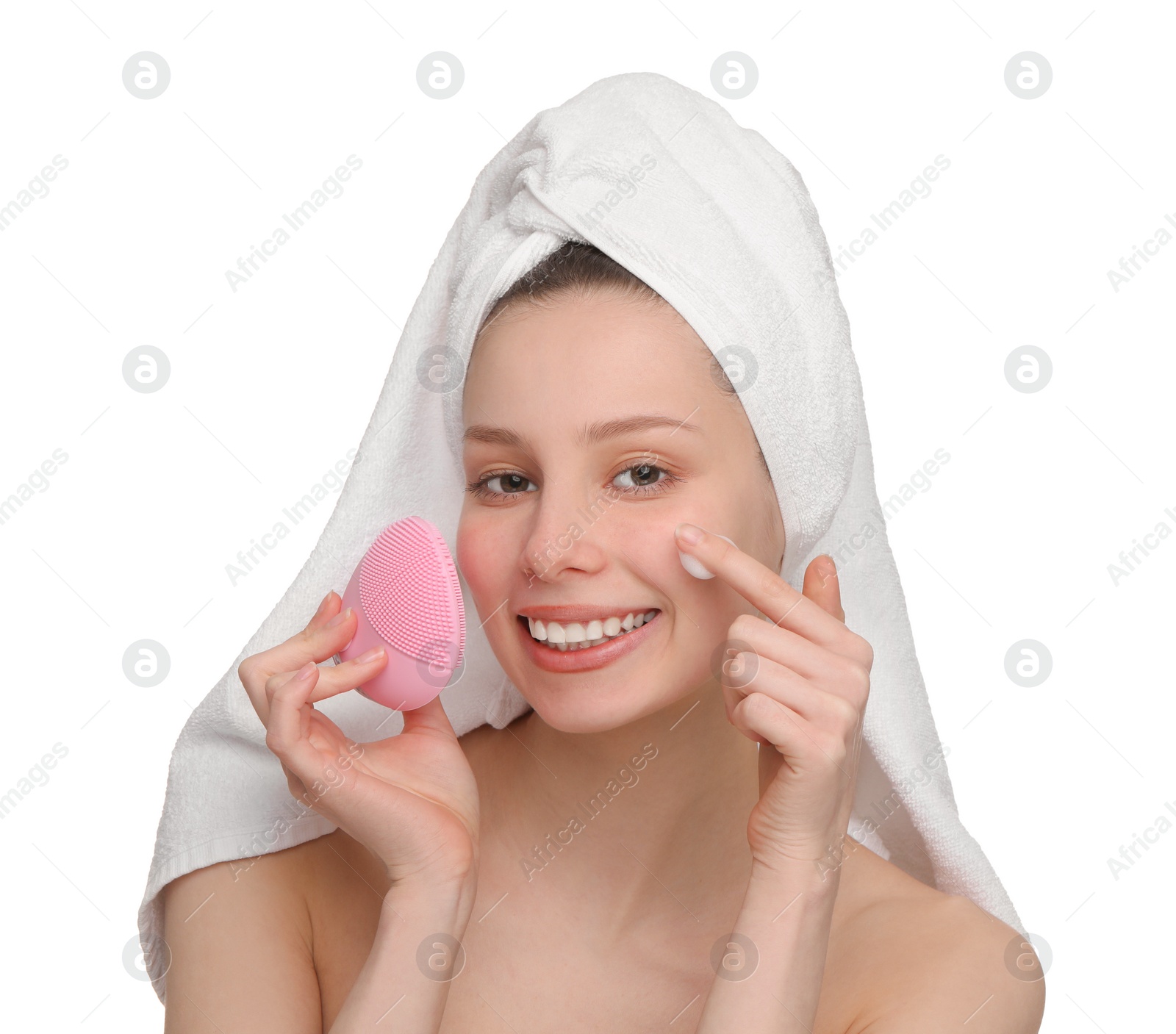 Photo of Washing face. Young woman with brush and cleansing foam on white background