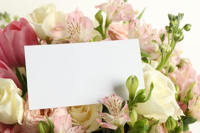 Photo of Happy Mother's Day. Beautiful flowers with blank card on light background, closeup