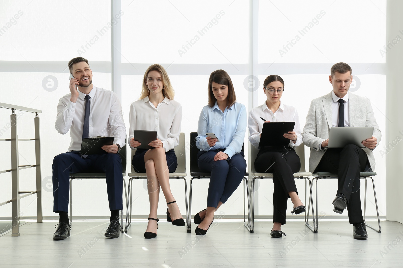 Photo of People waiting for job interview in office hall