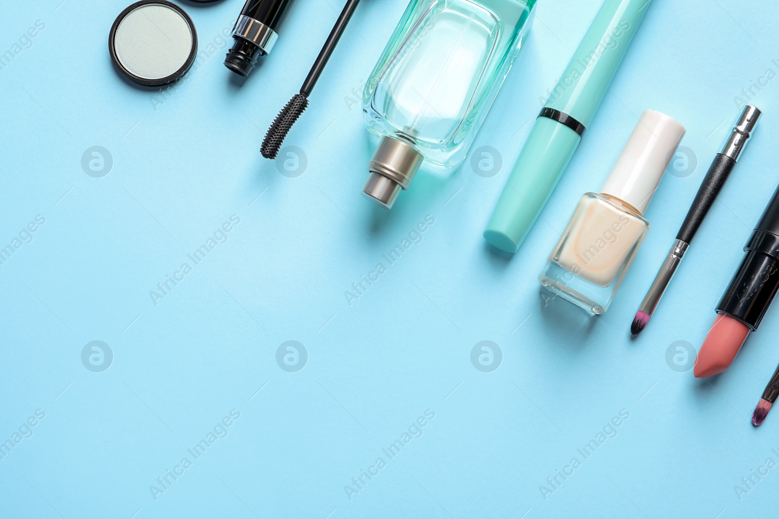 Photo of Flat lay composition with decorative cosmetics on color background