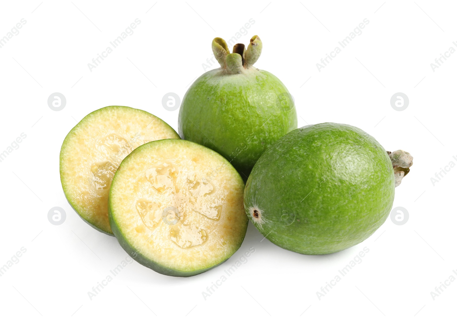 Photo of Whole and cut feijoa fruits on white background