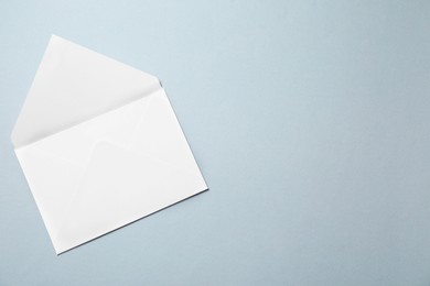 Letter envelope on grey background, top view. Space for text