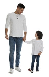 Little boy with his father on white background