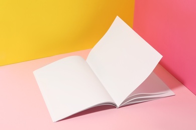 Photo of Empty book pages on color background. Mockup for design