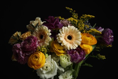 Photo of Beautiful fresh flowers on dark background, closeup
