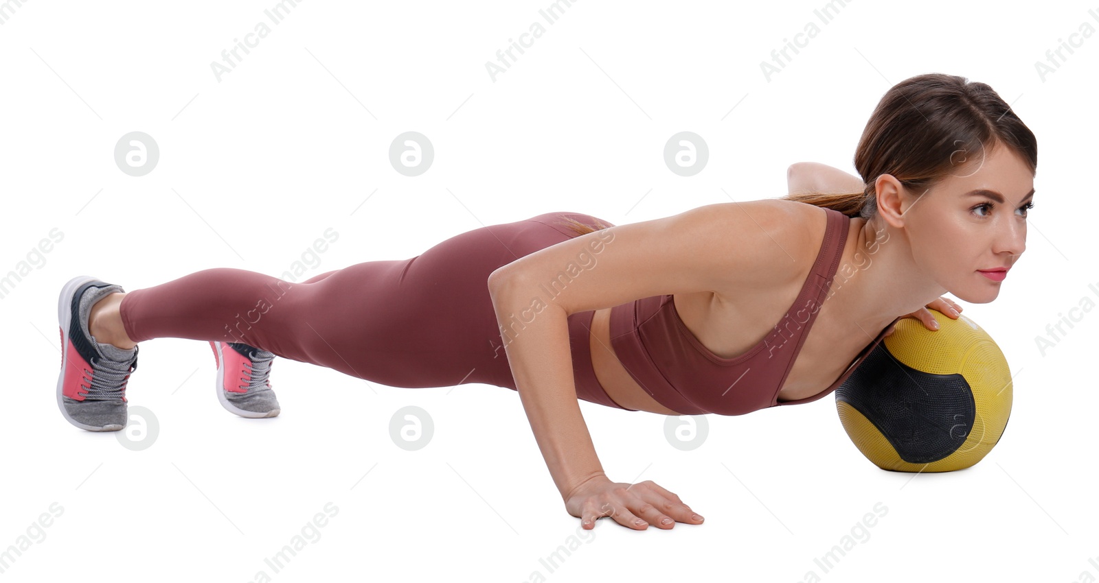 Photo of Athletic woman doing exercise with medicine ball isolated on white