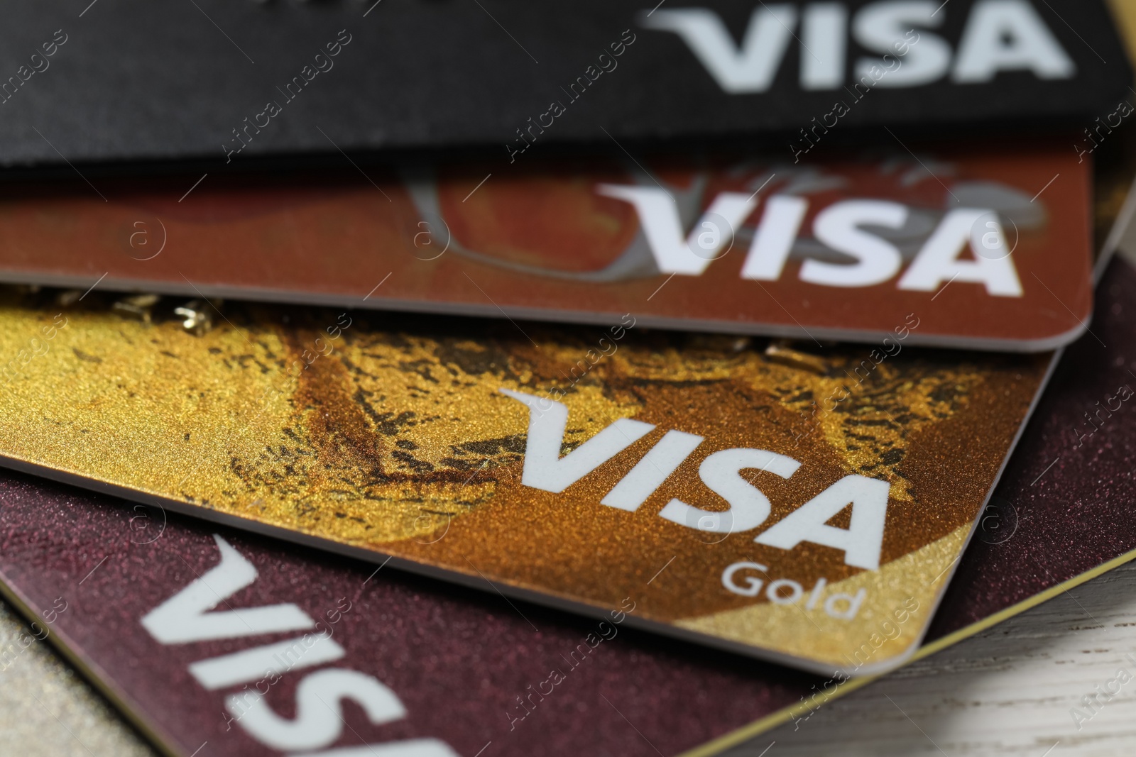 Photo of MYKOLAIV, UKRAINE - FEBRUARY 22, 2022: Visa credit cards on white table, closeup