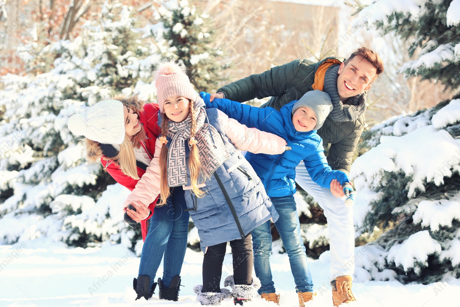 Photo of Portrait of happy family in winter park