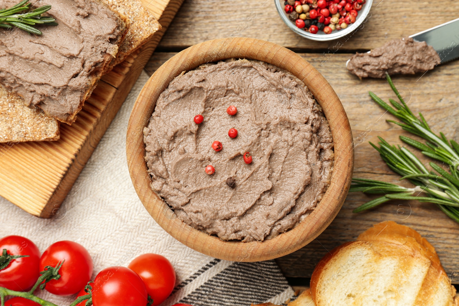 Photo of Flat lay composition with tasty liver pate on wooden table