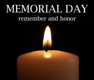 Image of Memorial day. Wax candle burning on black background, closeup