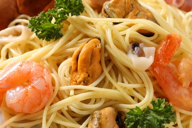 Photo of Delicious spaghetti with seafood as background, closeup