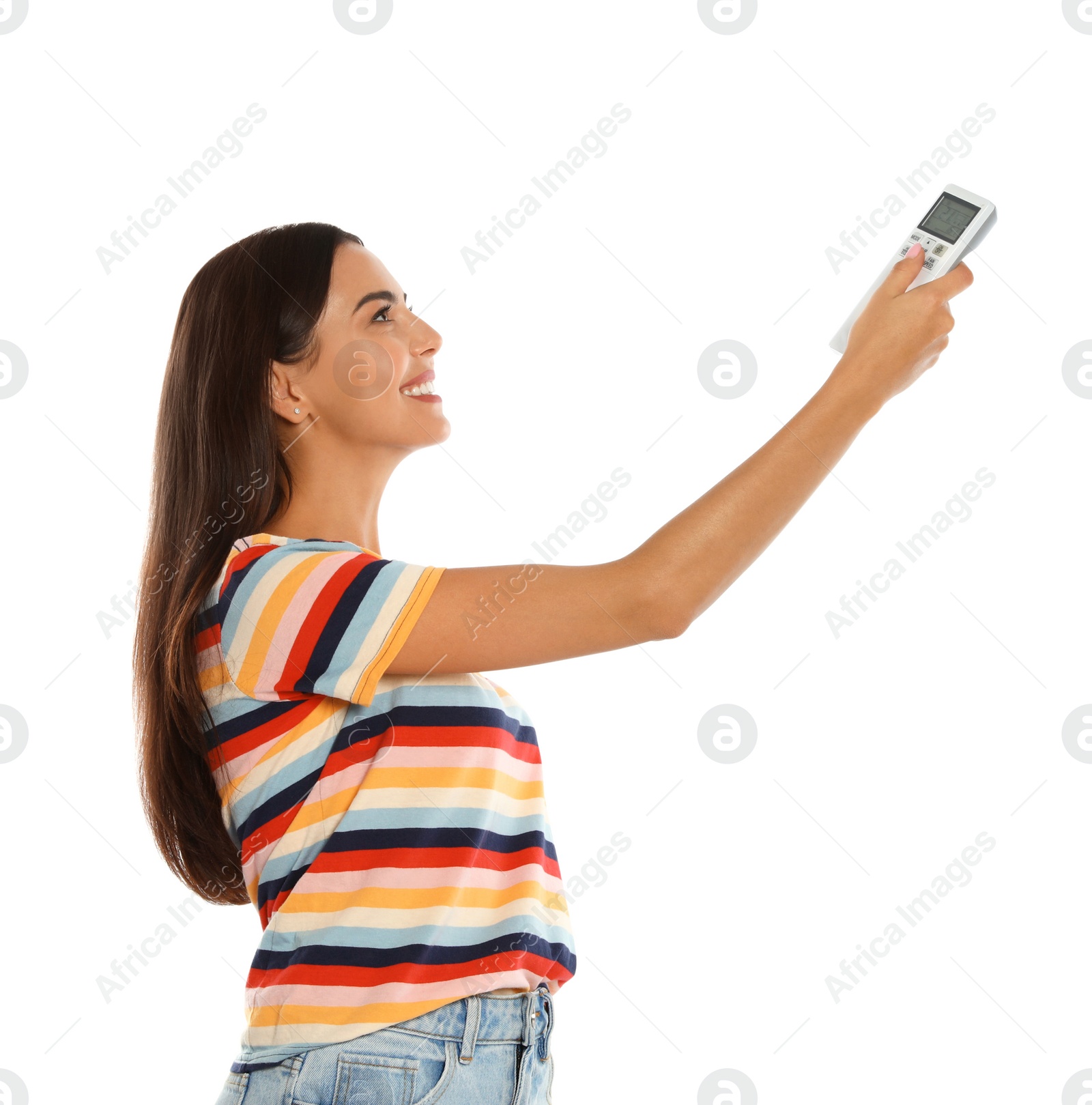 Photo of Young woman turning on air conditioner against white background