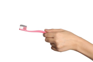 Photo of Woman holding brush with charcoal toothpaste against white background, closeup