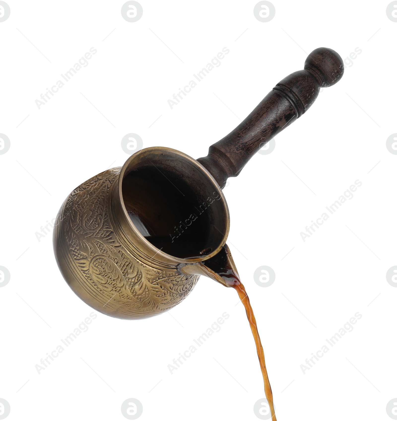 Photo of Turkish coffee. Pouring brewed beverage from cezve on white background