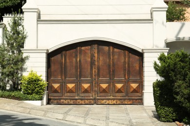 Beautiful old metal gate and white wall outdoors