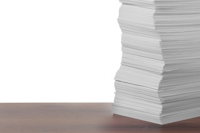 Photo of Stack of paper sheets on wooden table against white background. Space for text