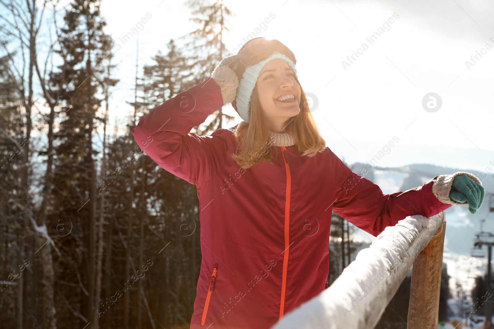 Photo of Happy young woman spending winter vacation in mountains