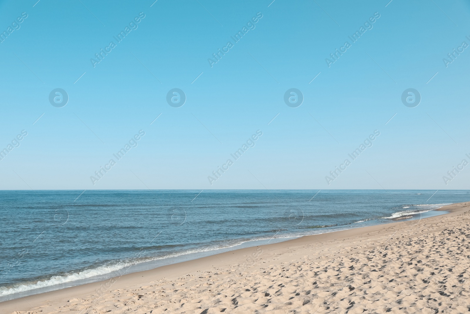 Photo of Picturesque view of sandy beach near sea