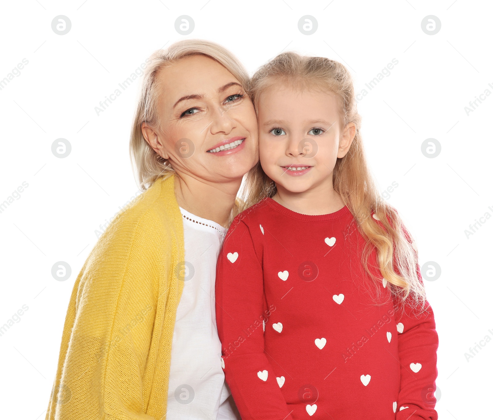 Photo of Portrait of mature woman and her granddaughter isolated on white