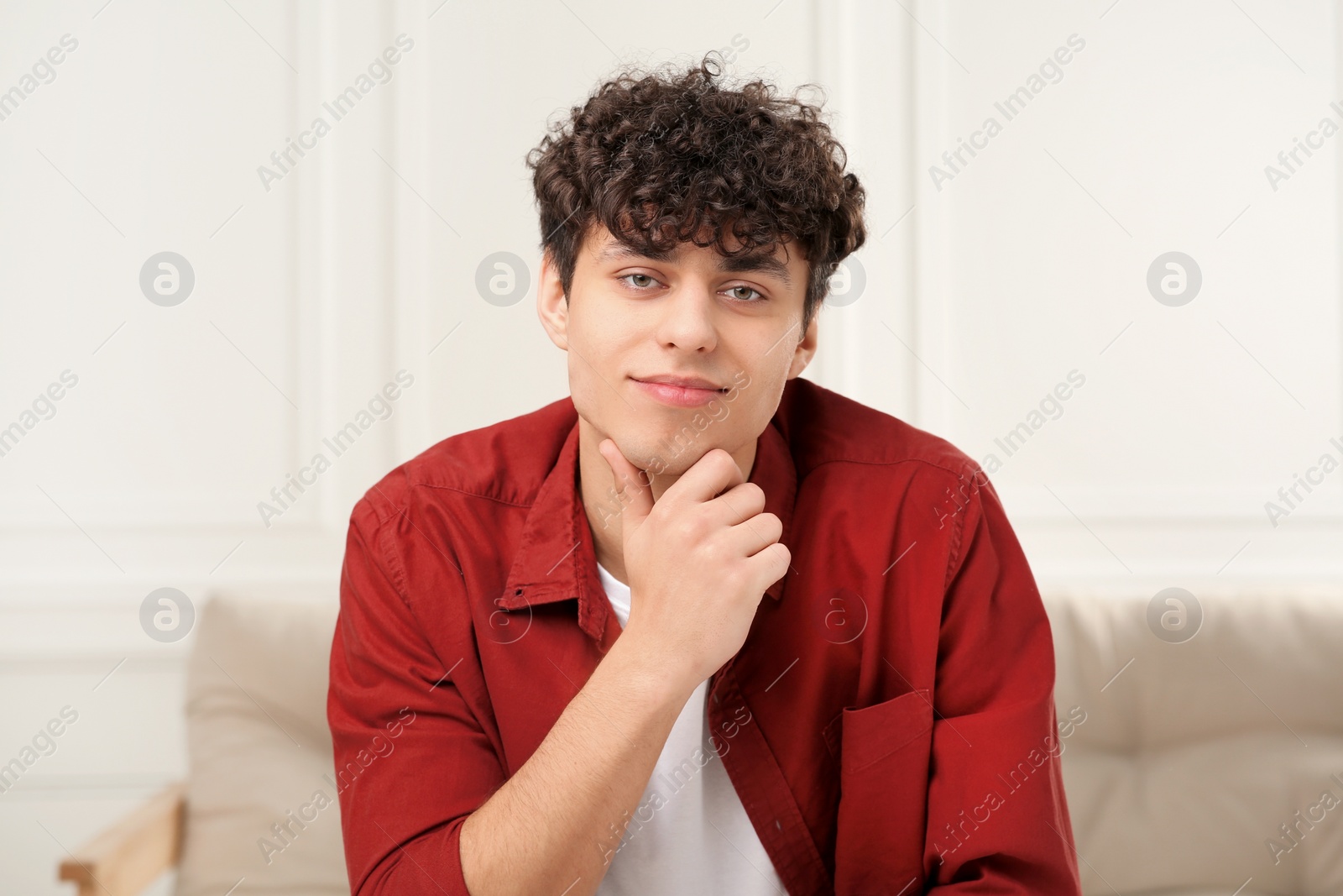 Photo of Young man having online video call at home, view from web camera