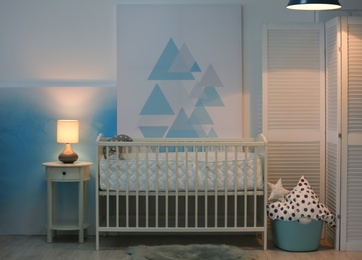 Baby bedroom interior with crib and beautiful decor elements