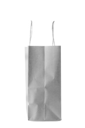 Photo of Empty paper shopping bag on white background