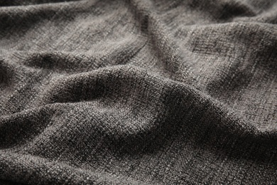 Soft warm grey plaid as background, closeup