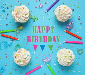 Image of Flat lay composition with delicious cupcakes and text Happy Birthday on light blue background