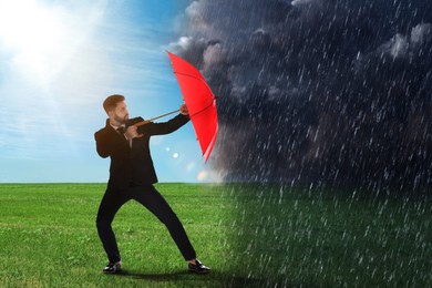 Businessman with umbrella under heavy rain. Insurance concept