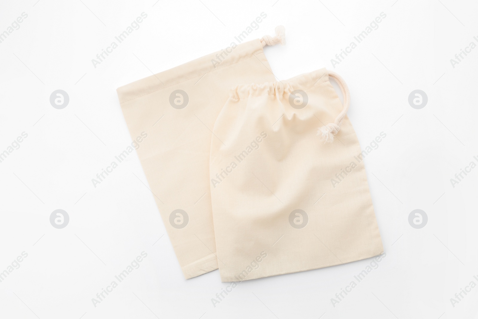 Photo of Cotton eco bags isolated on white, top view