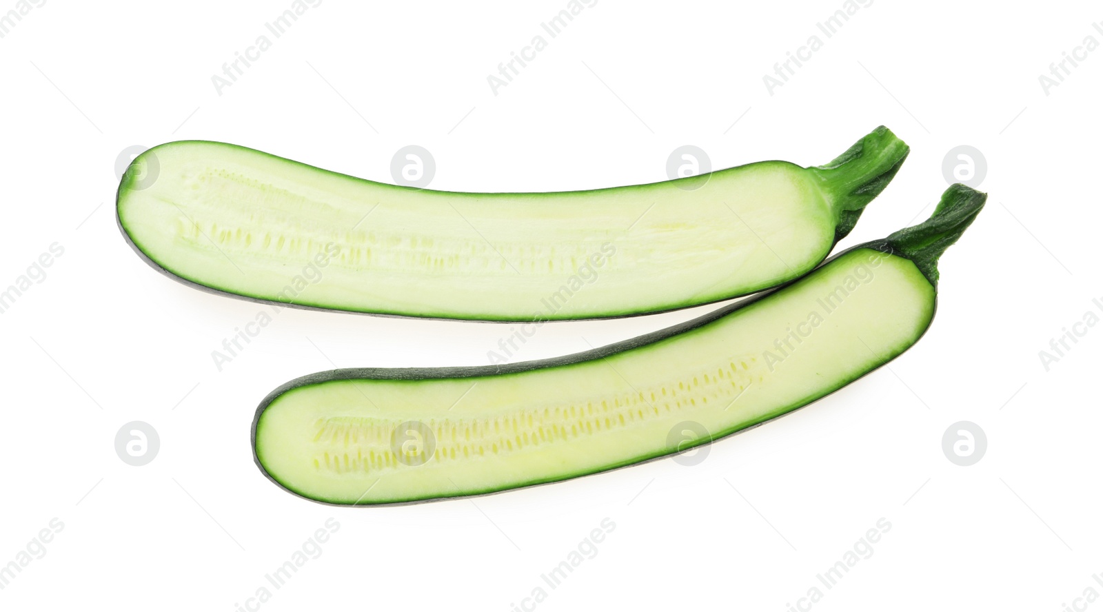 Photo of Halves of ripe zucchini on white background, top view