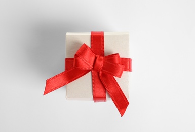 Beautifully wrapped gift box on white background, top view