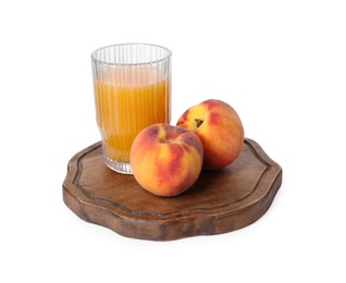 Glass of delicious juice and peaches isolated on white